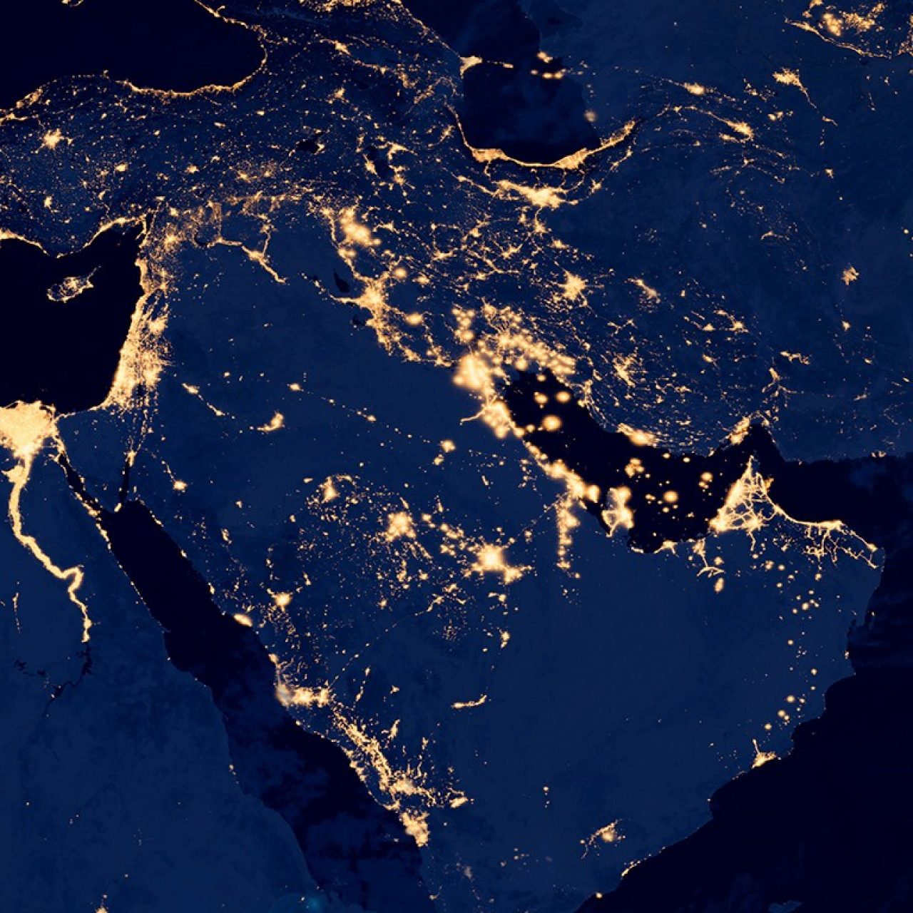 Nighttime satellite map of the Middle East showing concentrated population and economic activity along the Nile, Red Sea and Persian Gulf coasts.